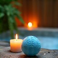 Zen scene with candles, plants, and blue bath bomb fizz